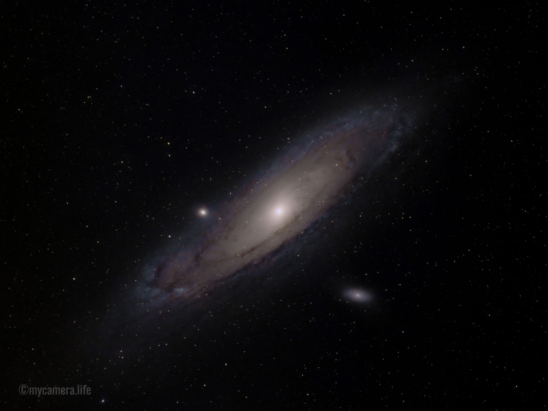 The Andromeda Galaxy (M31), a luminous spiral galaxy, shines brightly in the vast, star-filled expanse of deep space.